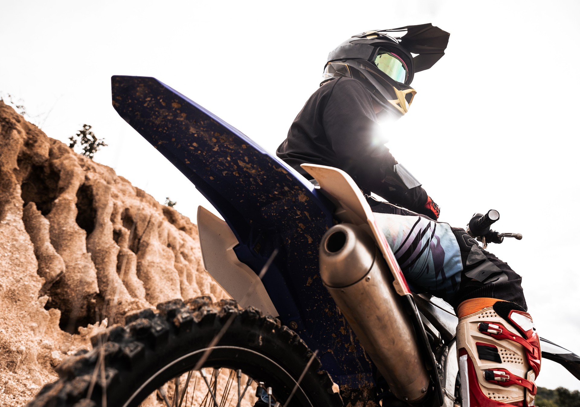 Motocross rider on his bike ready to race in dirt track